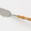 Couverts|Couverts<Flamant HADIS, serveur de gâteau